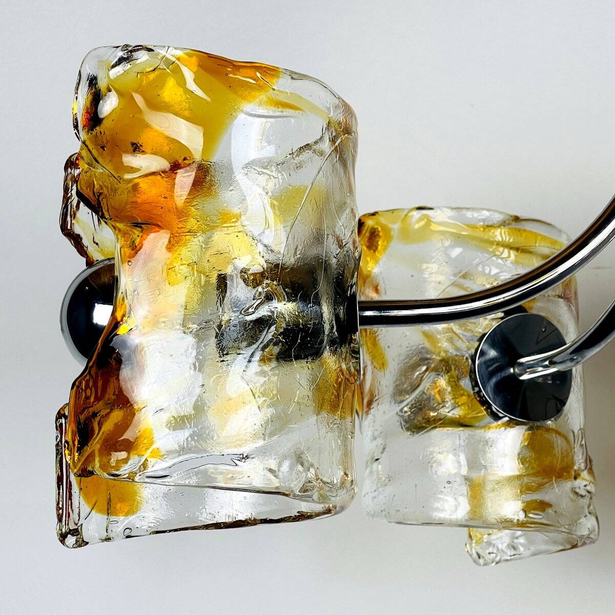 Mid-century chandelier in amber Murano and chrome by Toni Zuccheri for Mazzega, Italy, 1970s.