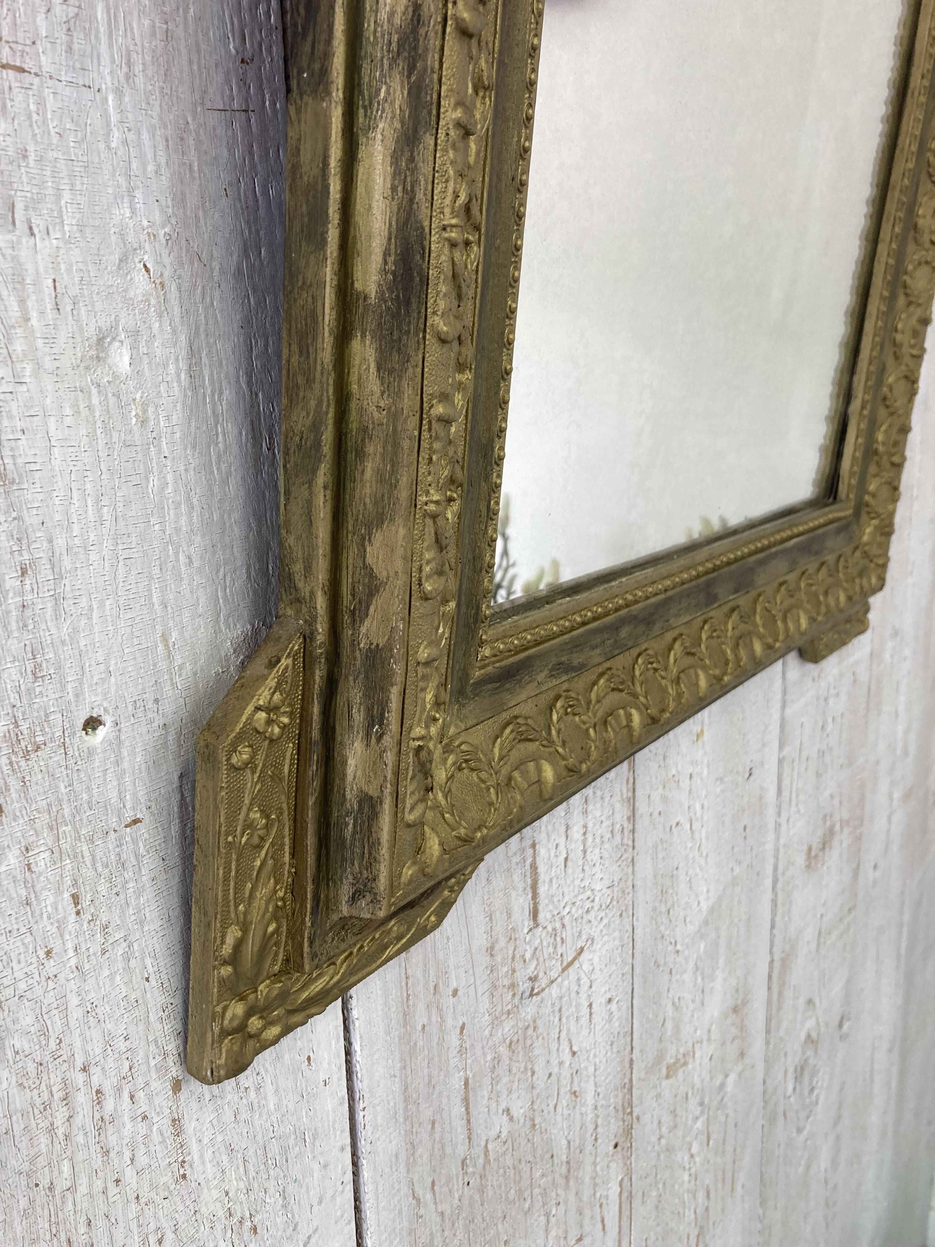 Antique mirror with a pediment