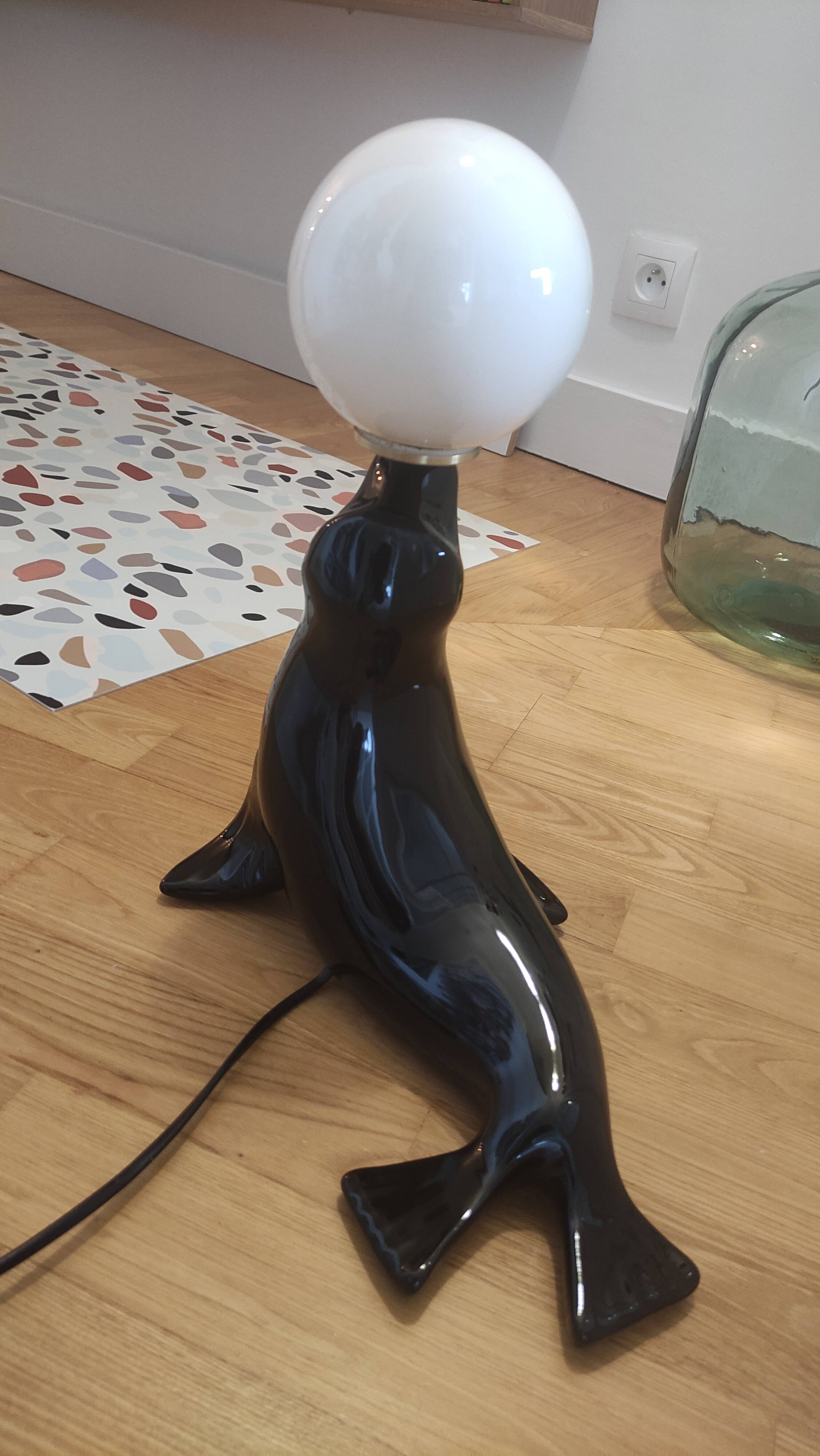 Vintage black sea lion lamp