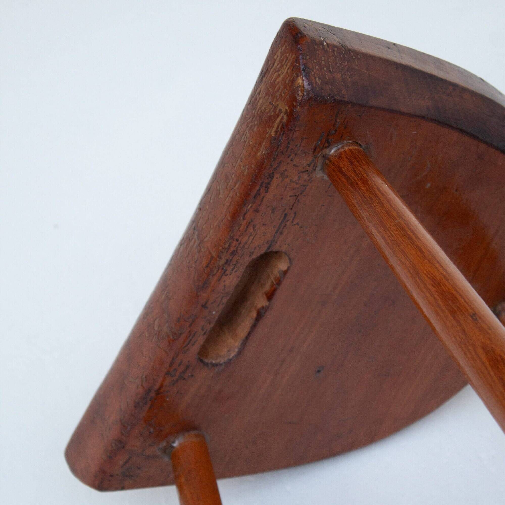Set of two hand-carved wooden stools with sculpted seats
