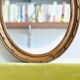 Antique oval mirror in carved wood