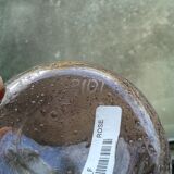 A bolted glass carafe
