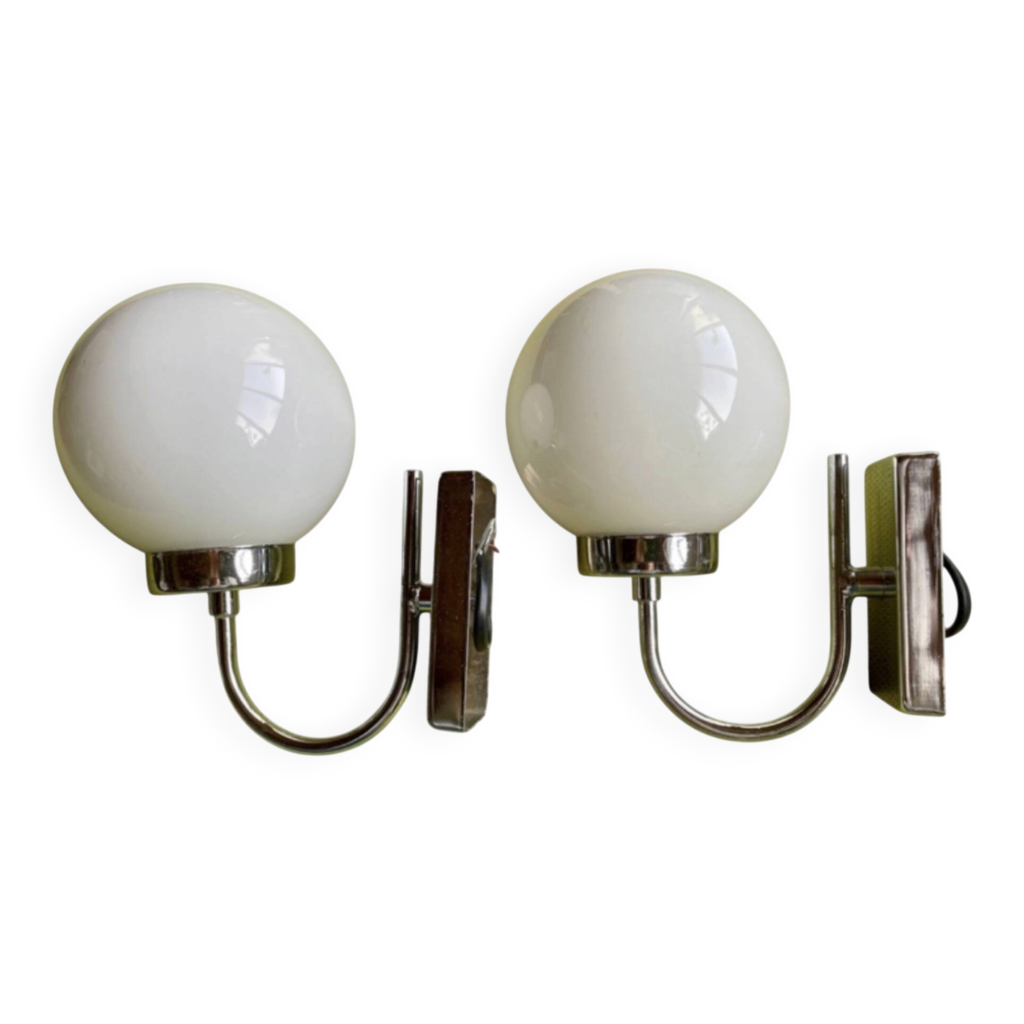 Pair of chrome metal wall lights with white glass globe.