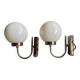 Pair of chrome metal wall lights with white glass globe.