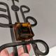 Vintage wall candle holder, wrought iron and  pressed orange/amber glass