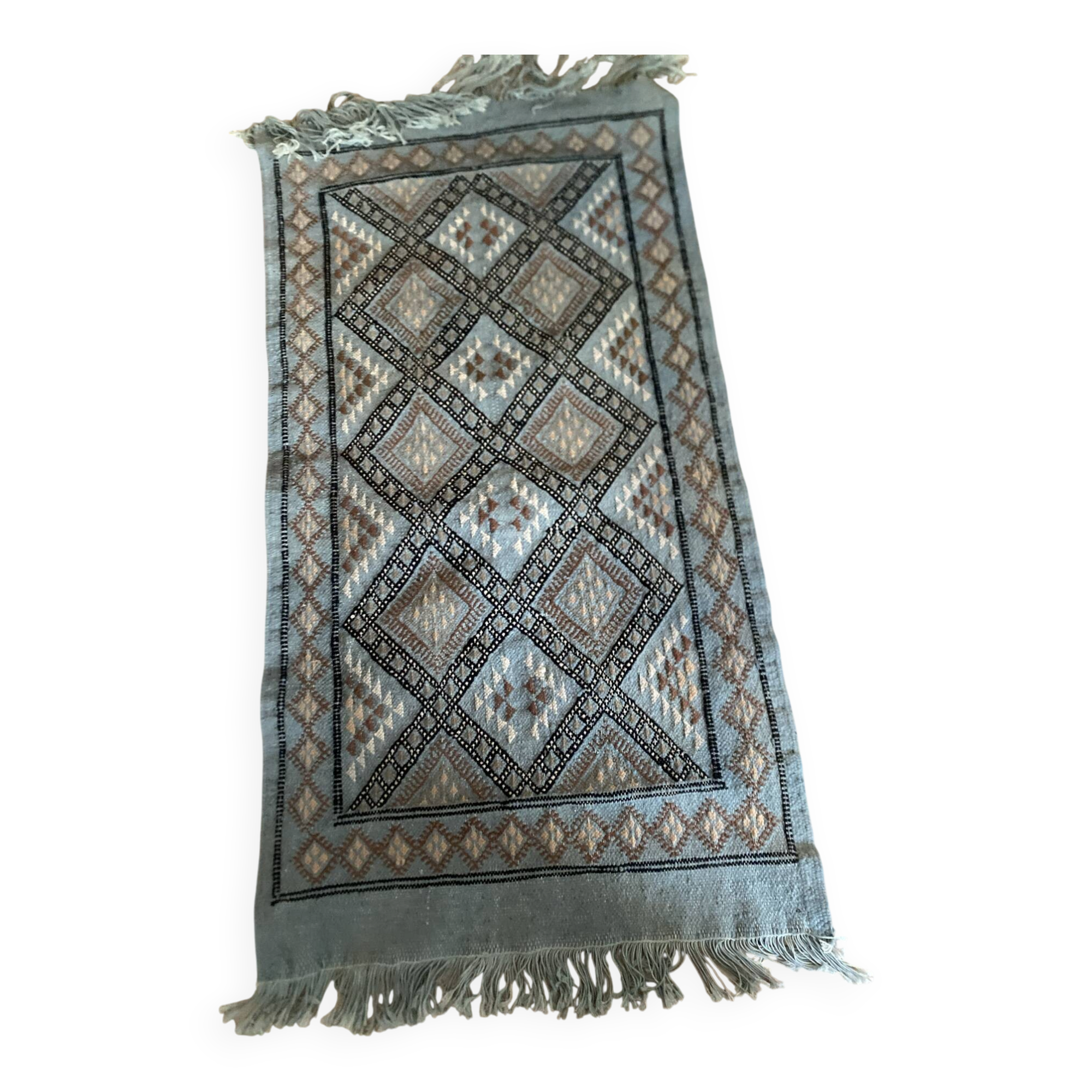 Handmade turquoise and beige wool rug, new.
