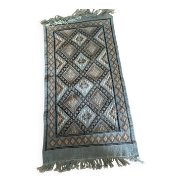 Handmade turquoise and beige wool rug, new.