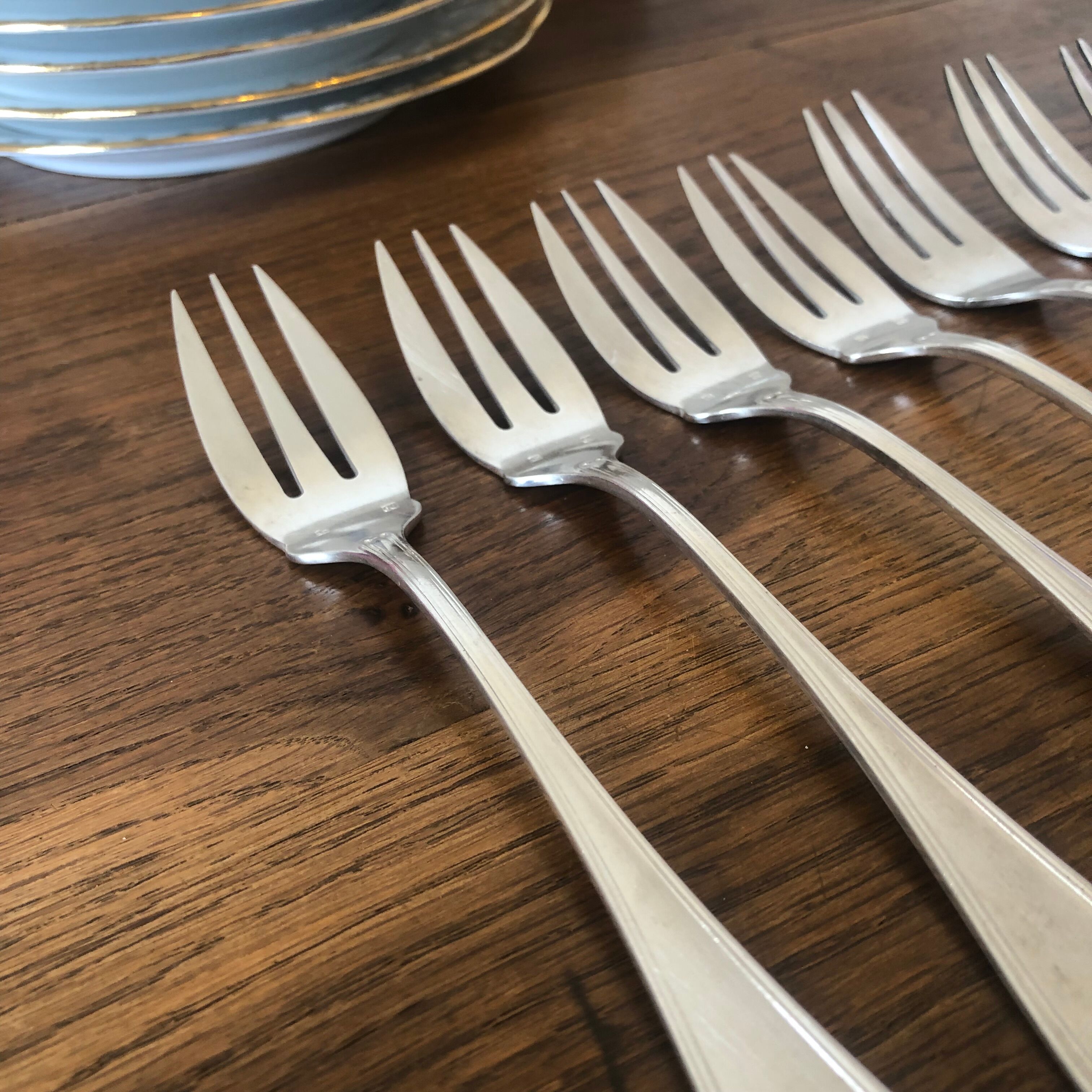 8 mismatched fish forks, silver metal