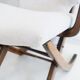 Pair of varnished wooden reclining armchairs, upholstered in lightweight fabric.