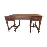 Flat walnut desk with eight feet turned