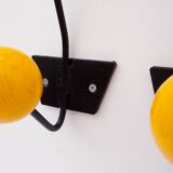 Paire de patères en métal noir et boules en bois rouge et jaune, années 1950