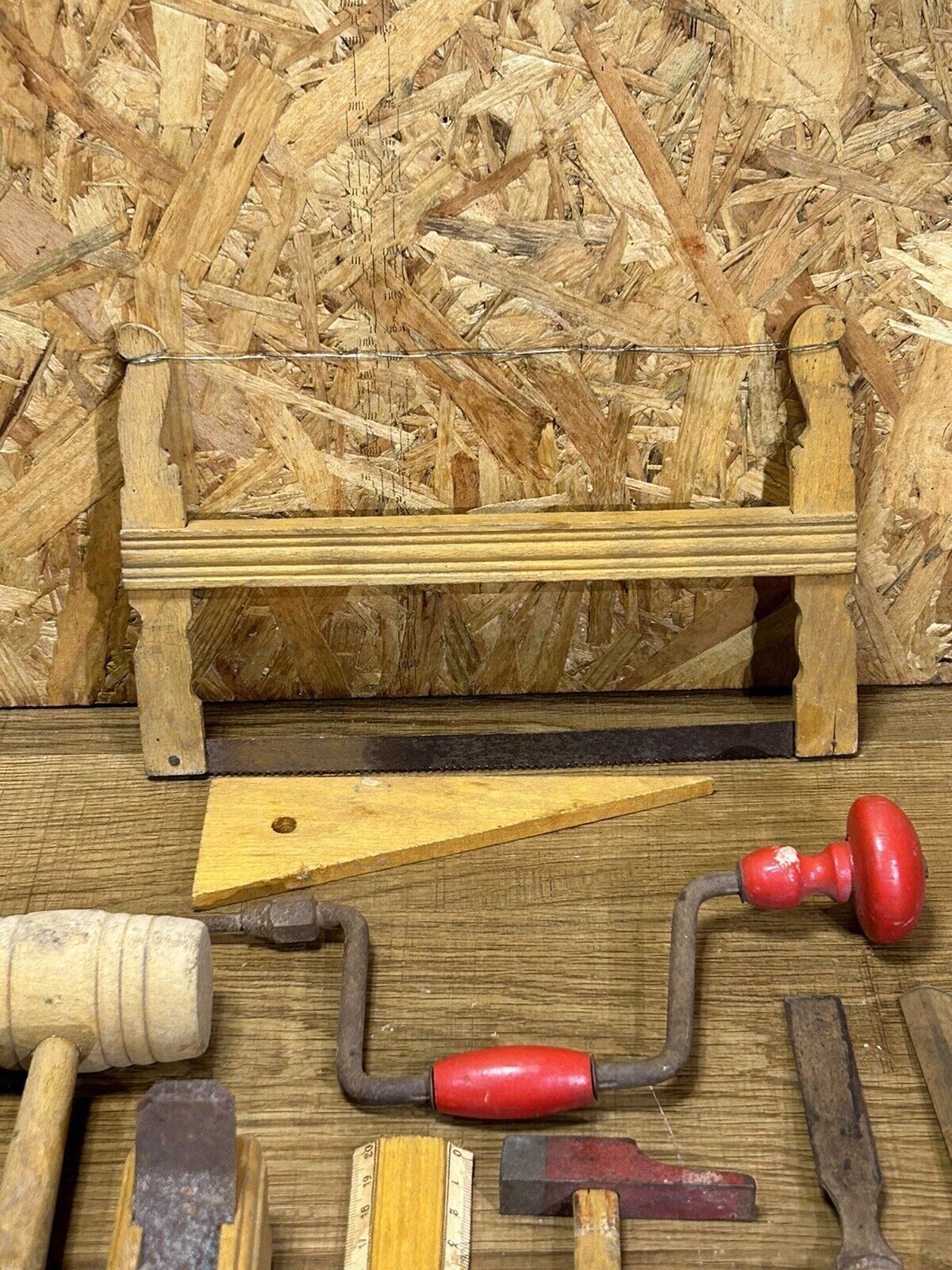 lot of antique toys, carpentry tools, wood, saw, plane, hammer,...
