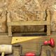 lot of antique toys, carpentry tools, wood, saw, plane, hammer,...