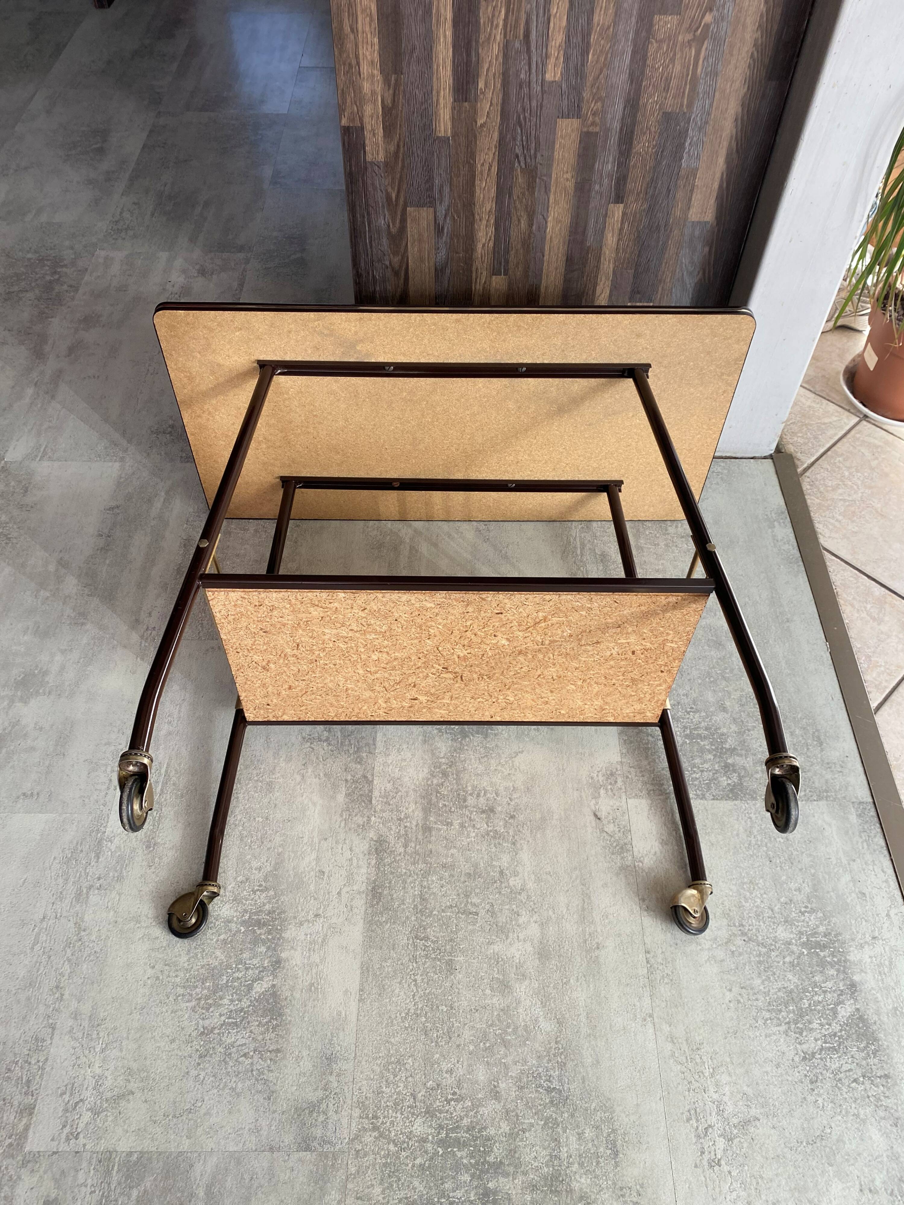 TV stand on casters, 2 brown Formica shelves, 1960s