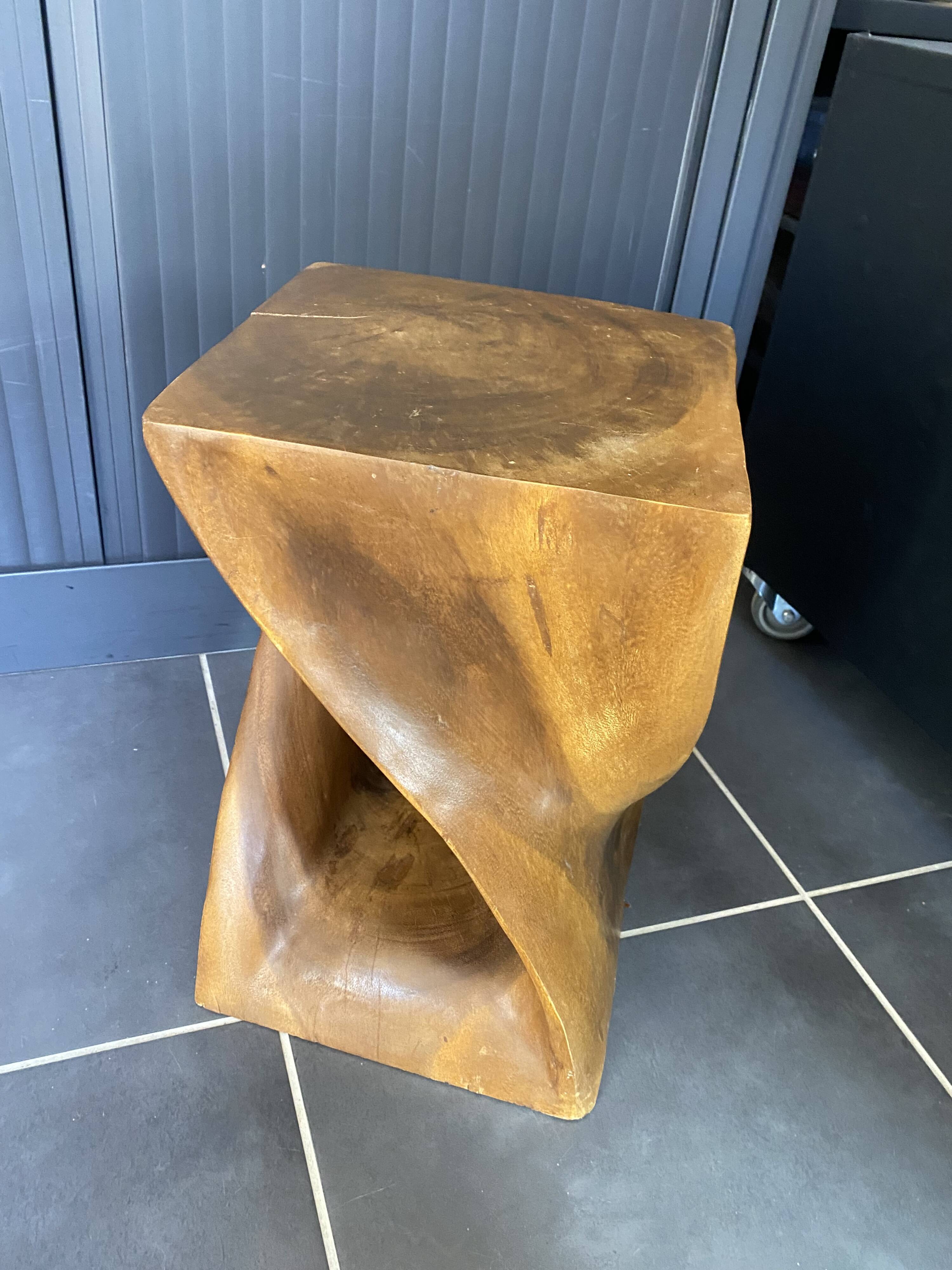 Stool no. 1 in solid raw walnut wood, carved from the mass, 1970.