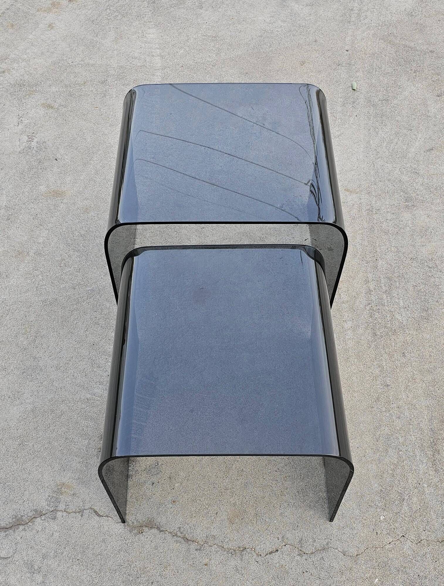 Pair of Waterfall nesting tables in tinted glass attributed to FIAM 1980s.