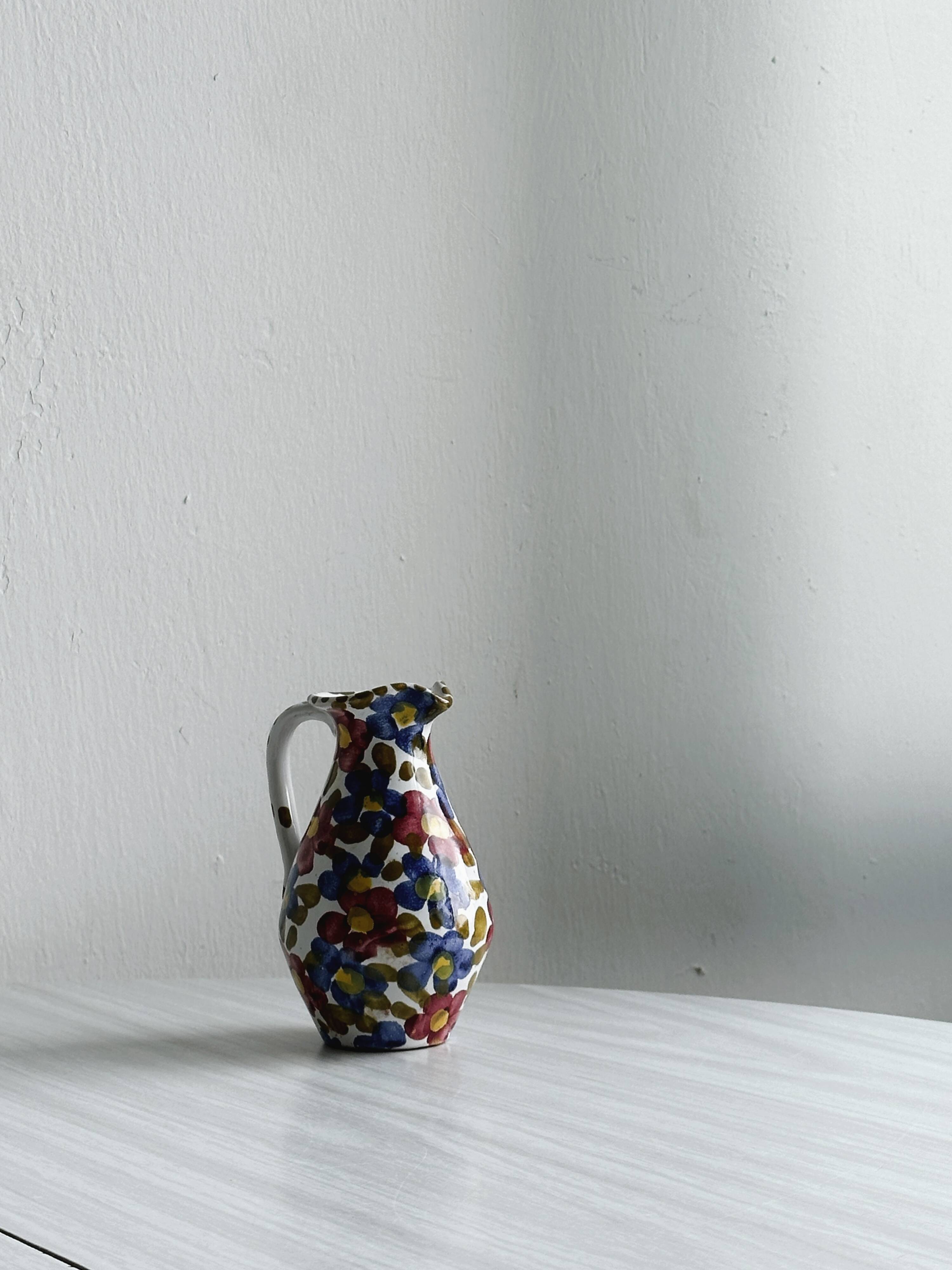 Hand painted ceramic milk jug, oiler