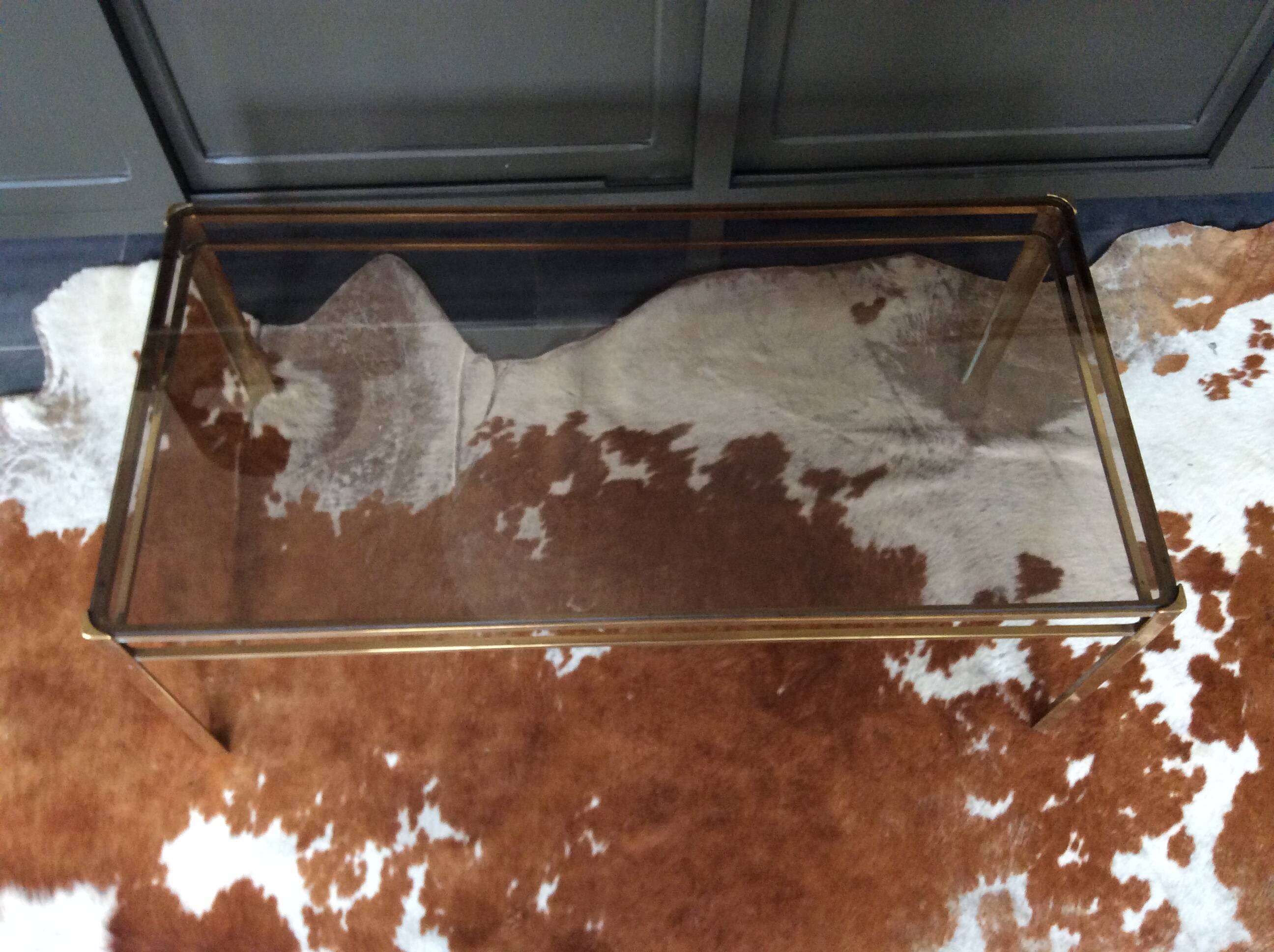 Glass and brass coffee table