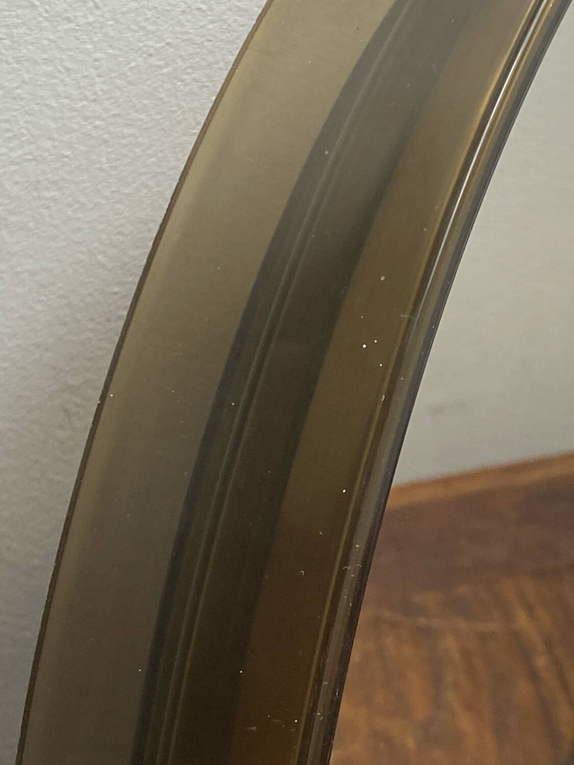 Circular mirror, smoked plastic, 1960s/70s.