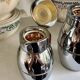 2 Hermès insulated jugs in chrome metal and covered leather.