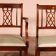 set of 10 chairs and two mahogany armchairs in Hepplewhite style