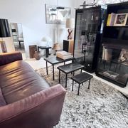 Brutalist nesting table in ebonized oak and wrought iron
