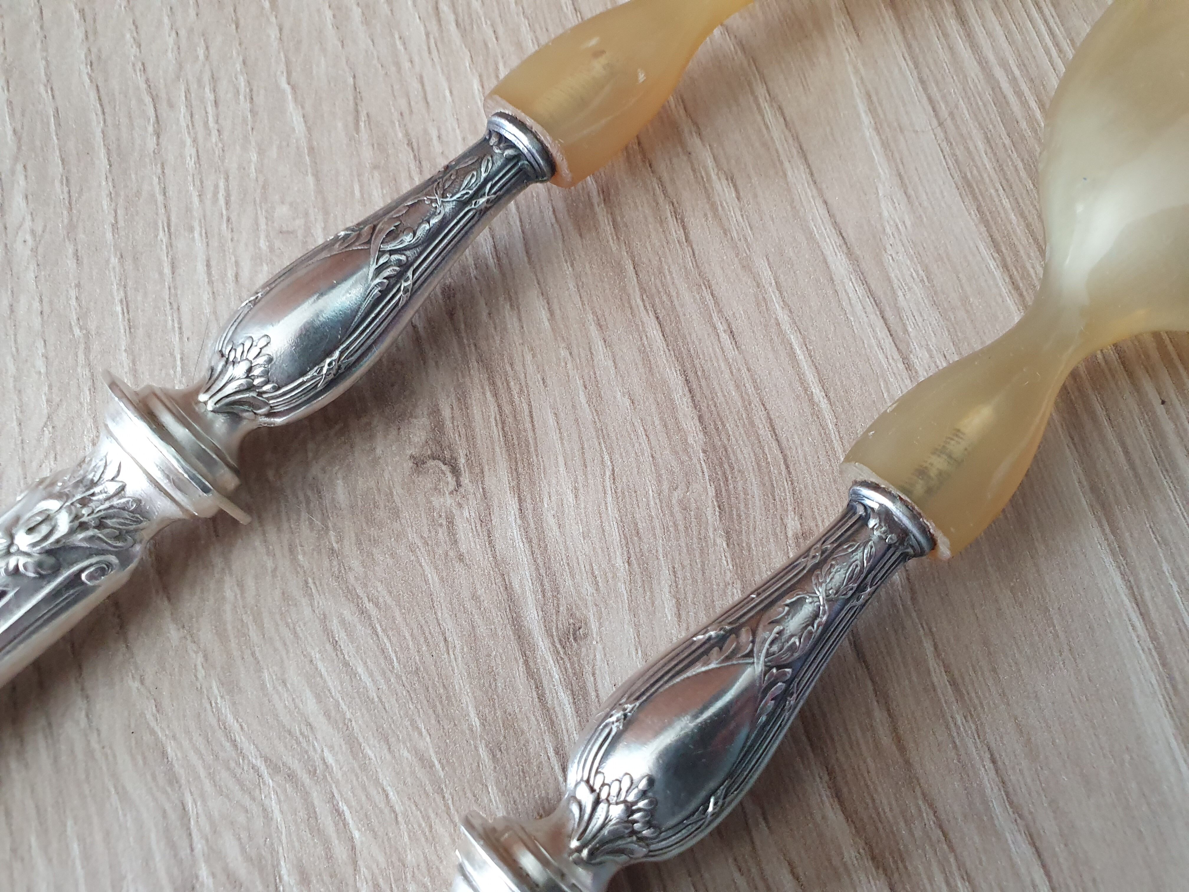 Filled silver metal handle salad covers