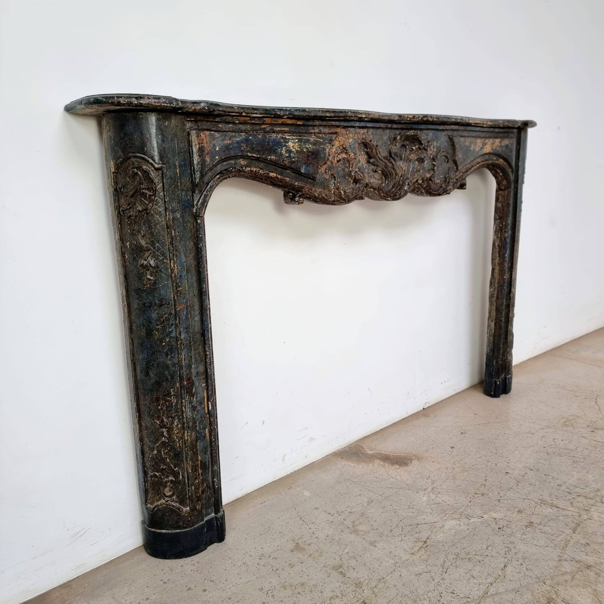 18th century carved wooden fireplace