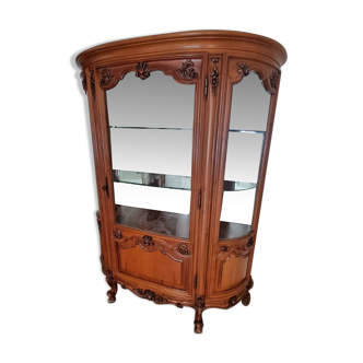 Silver display cabinet with a curved design.