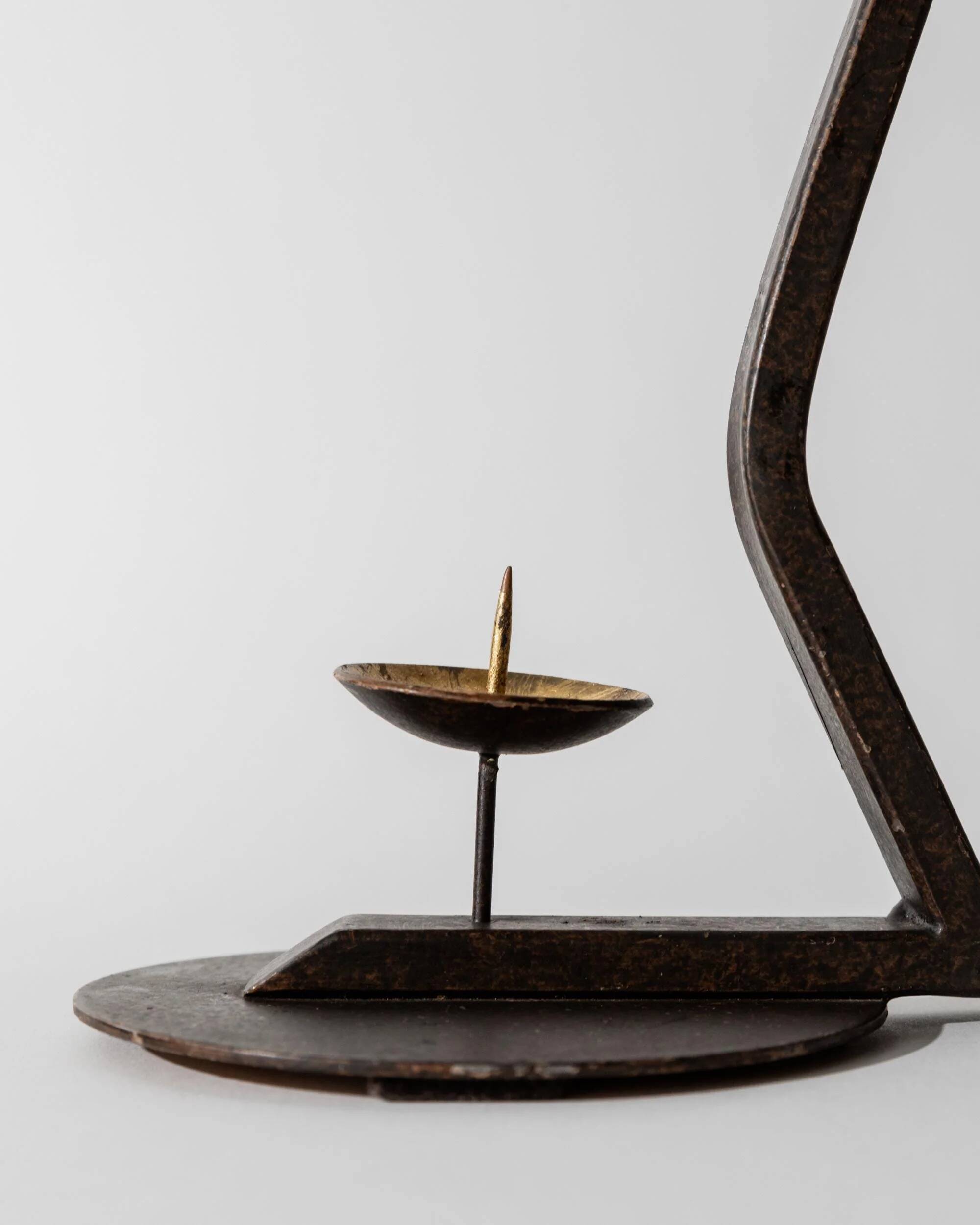 Vintage wrought iron candlestick from the 1960s, zigzag design with removable snuffer.