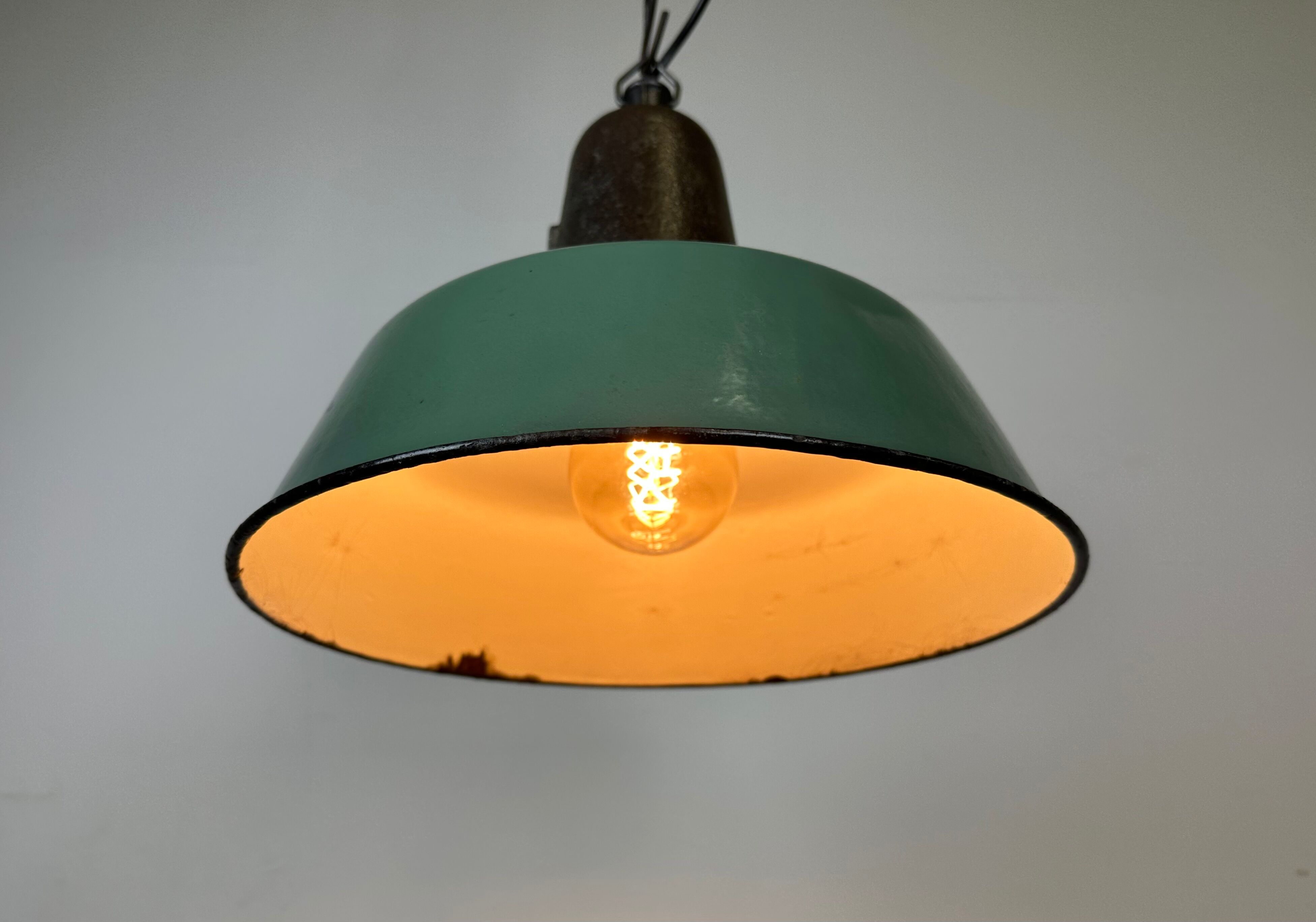 Industrial green enamel factory lamp with cast iron top, 1960s