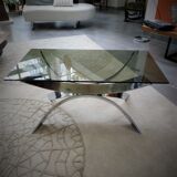 A chrome-shaped table and a 70s glass tray
