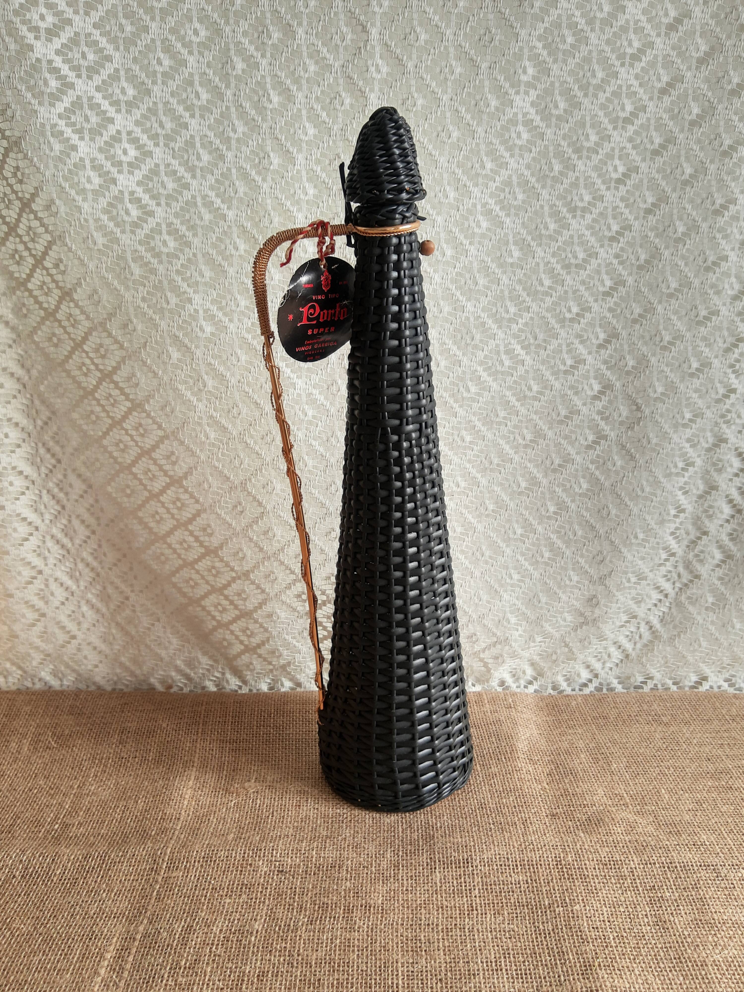 Glass bottle covered with black scoubidou with twisted golden handle - vintage