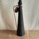 Glass bottle covered with black scoubidou with twisted golden handle - vintage