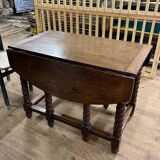 Wooden table with gateleg flaps