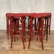 Series of 9 bistro bar stools in curved wooden restaurant sitting red fabric