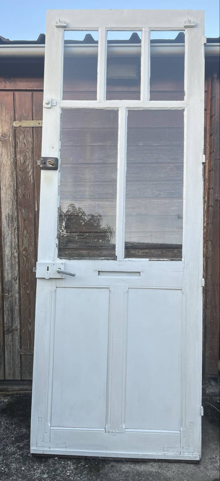 Porte d'entrée ancienne semi-vitrée en bois