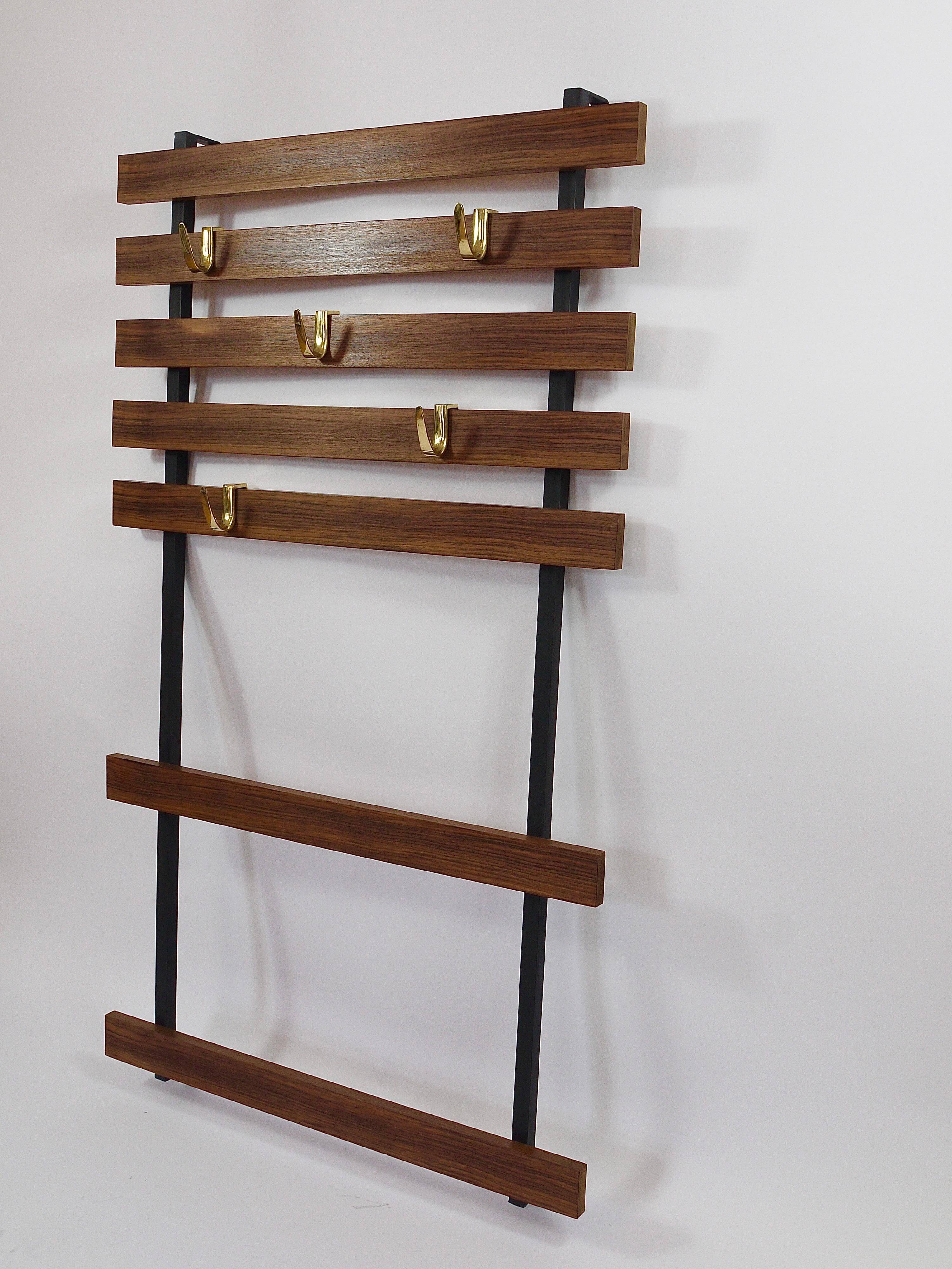 Wall coat rack by Carl Aubock with 5 brass hooks, walnut, iron, Austria, 1950s.