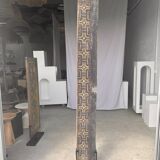 Indonesian construction element in carved wood with cross pattern in red, white geometric frieze