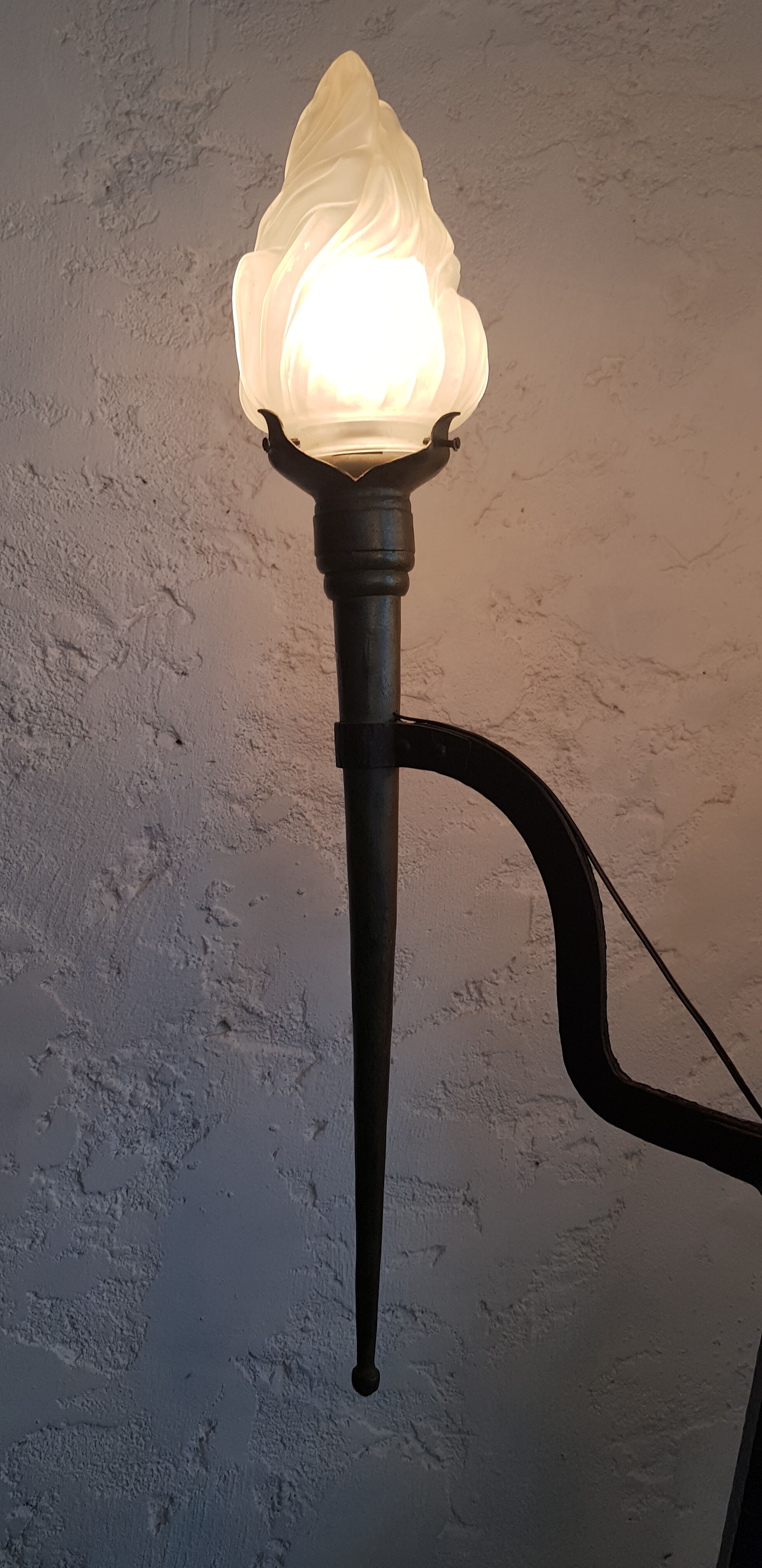 Old wrought iron tripod lamppost