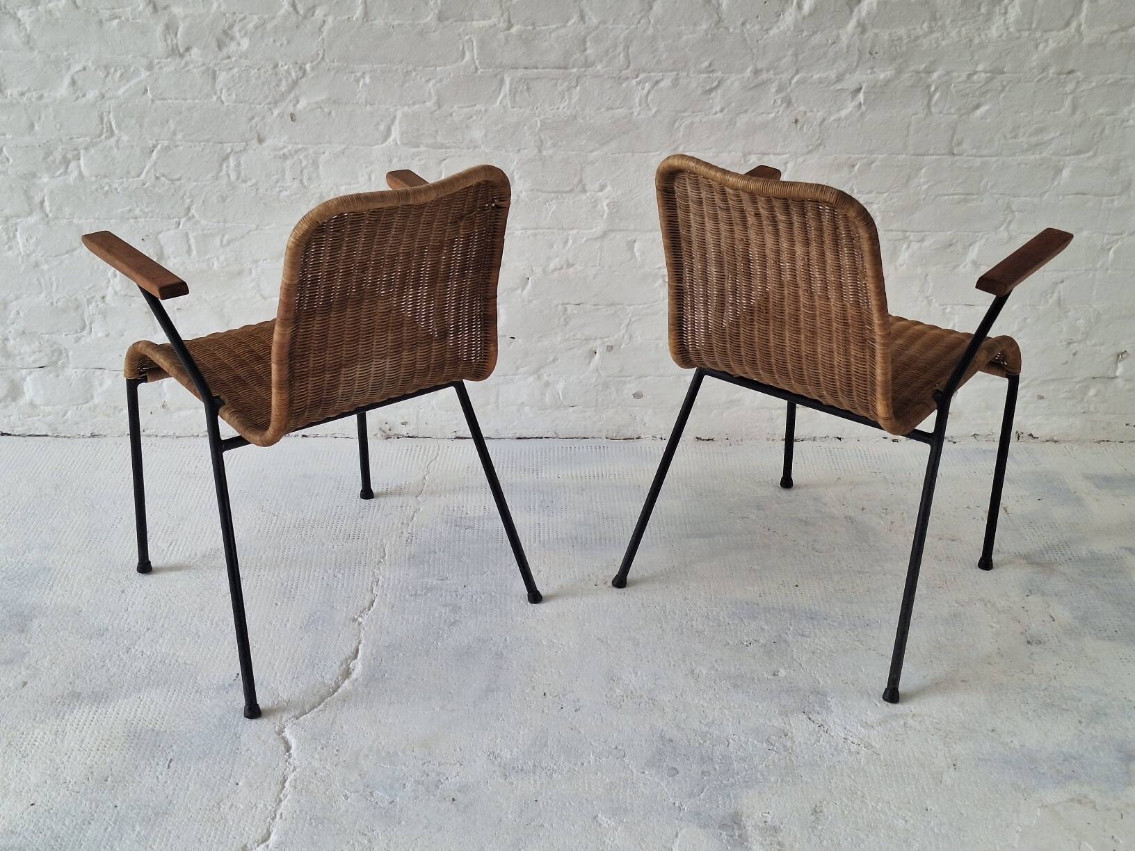 Pair of Swiss stackable rattan and iron dining elbow chairs, G Legler 1960s