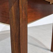 Extendable round rosewood dining table