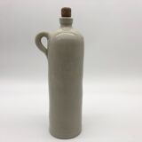Old hot water bottle in glazed stoneware, gray color.