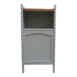 Vintage furniture of shallow depth re-enchanted in grey-green.