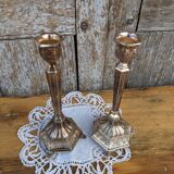Pair of chiseled metal candle holders