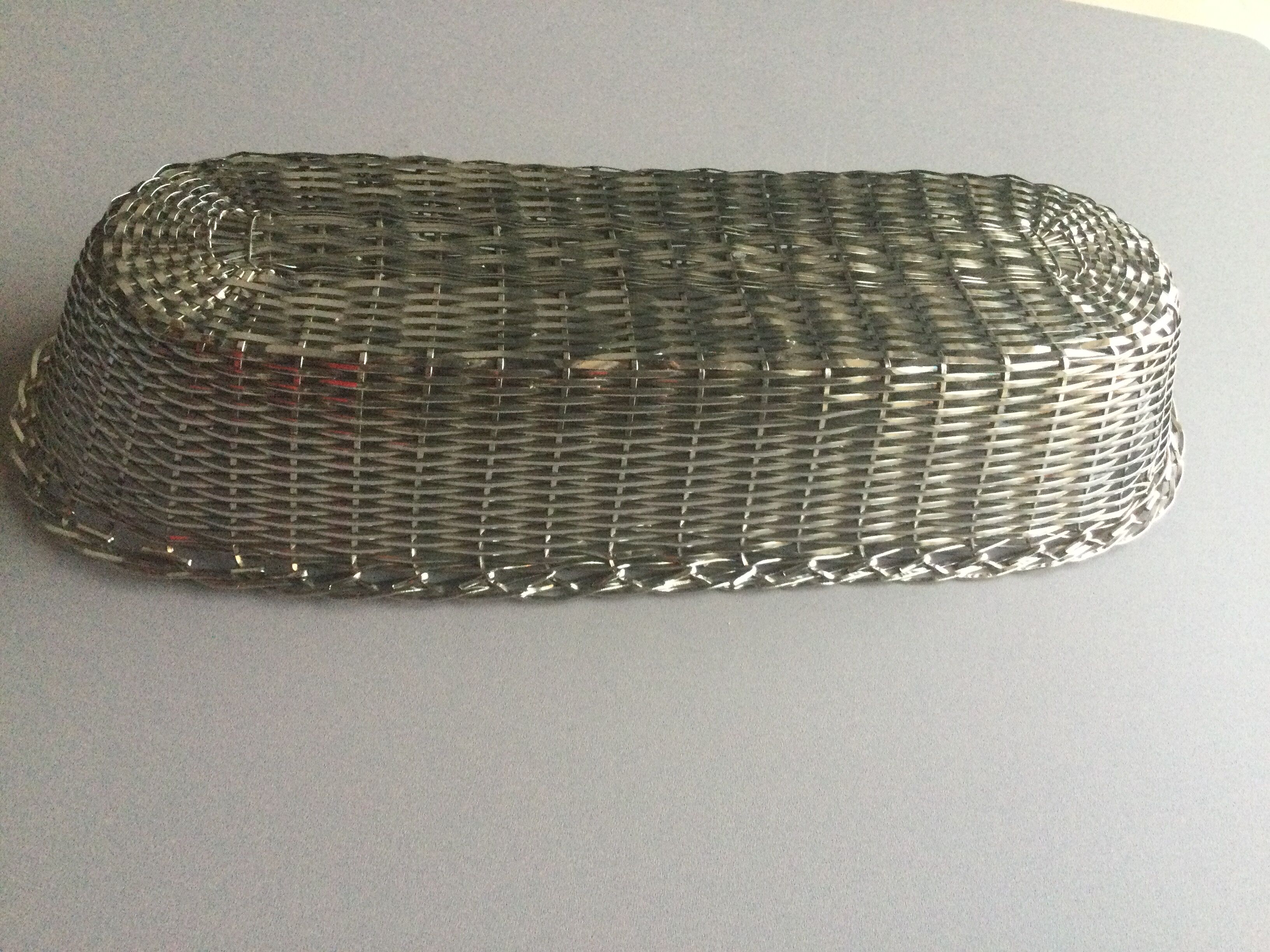 Braided silver metal bread basket