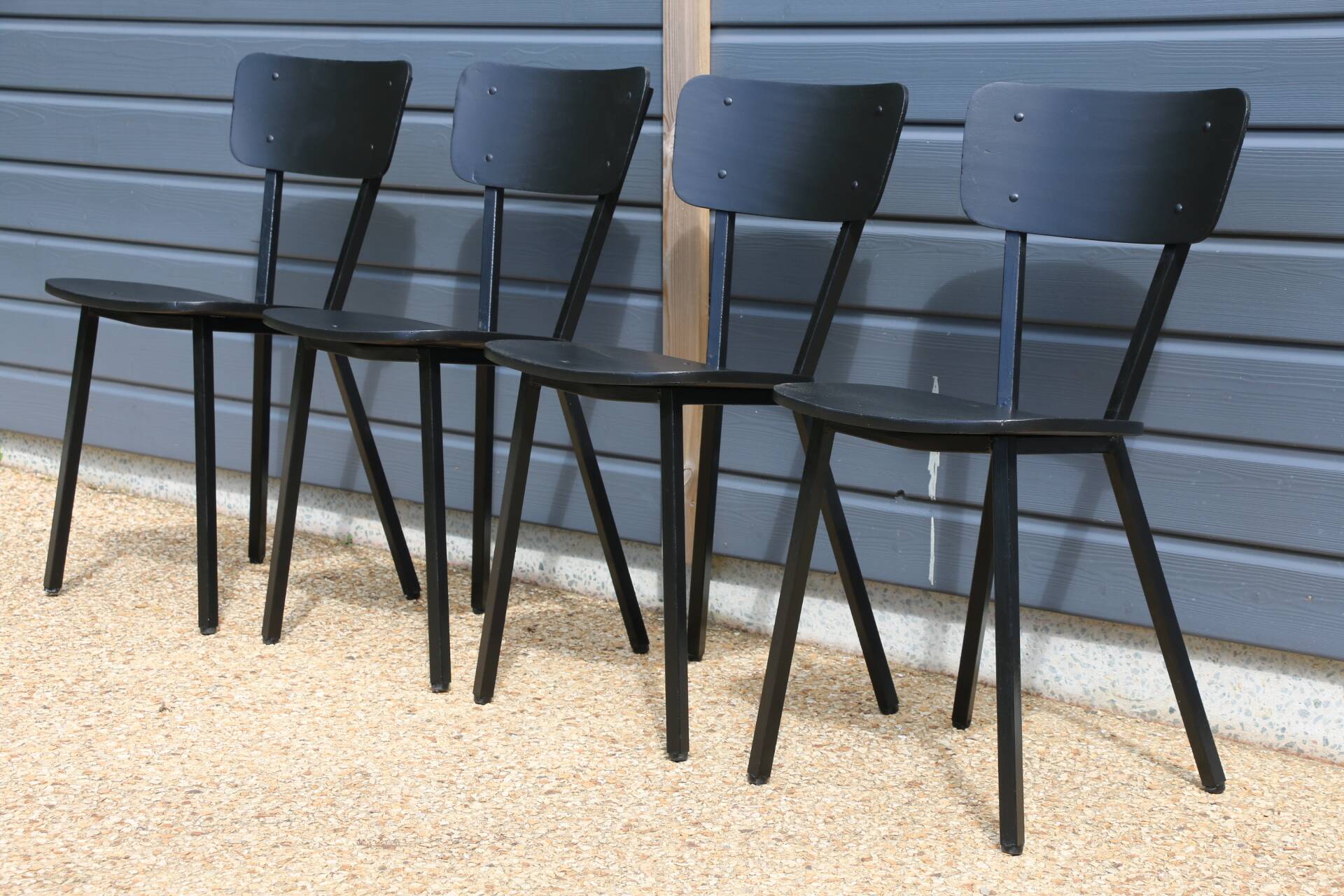 4 black metal and wood chairs