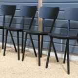 4 black metal and wood chairs