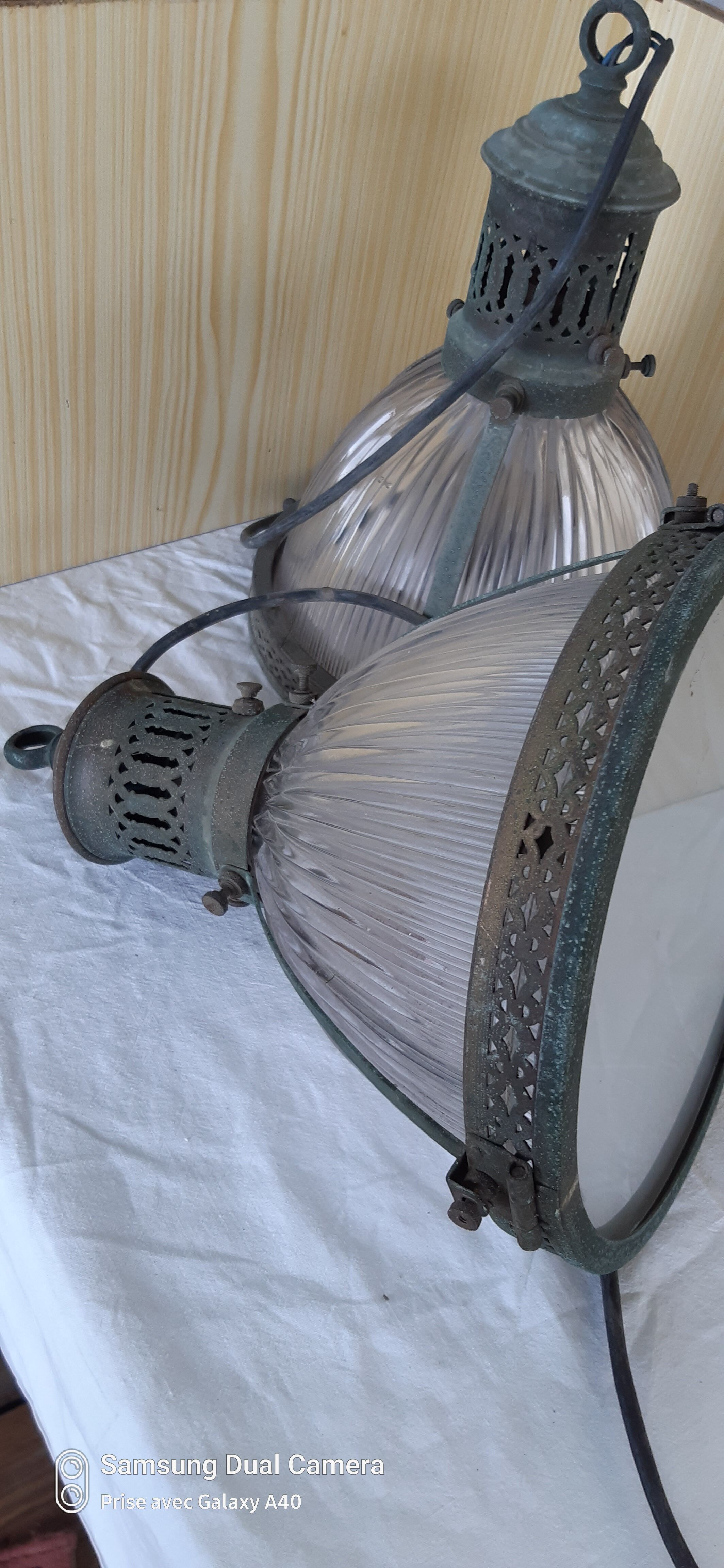 2 holophanous industrial lamps