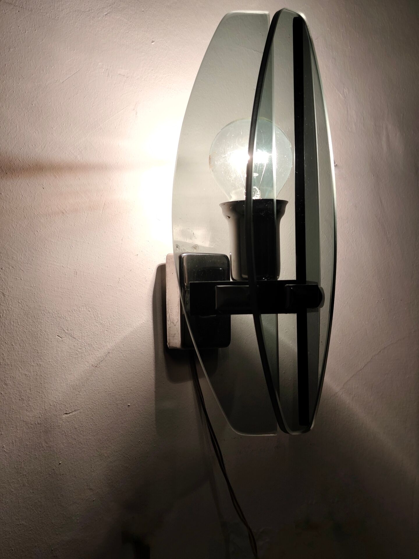 Smoked glass wall sconce. Italy, 1970s.